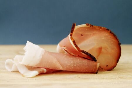 bacon on a wooden plateの写真素材