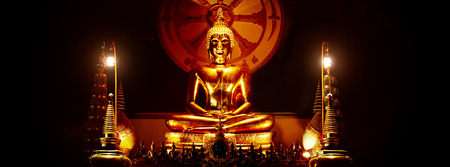 Buddha statue in black background.の写真素材