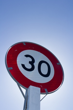 Speed limit sign for restricted zone in urban areas of 30 kmhの写真素材