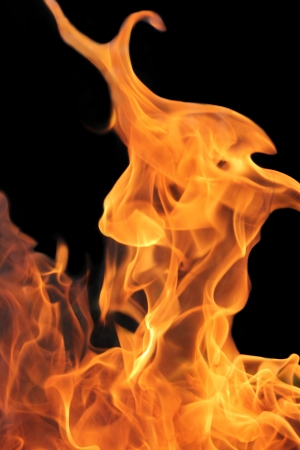 bright Orage flames with a doark backgroundの写真素材