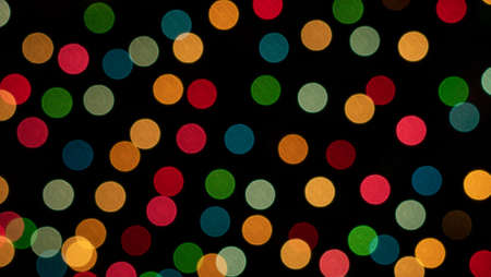 Color photo of blurred Christmas lights at nightの写真素材