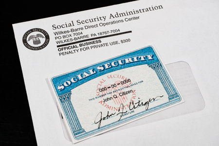 Fake social security card on corner of SSA statement envelope.の写真素材