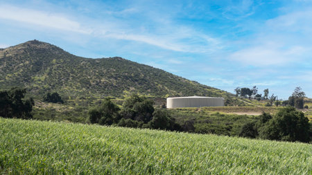 Large water storage tank in hills above Menifee, Californiaの写真素材