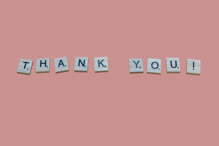 Lake Elsinore, CA, USA - September 17, 2023: Scrabble tiles isolated on black background spelling out thank Youのeditorial素材