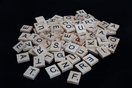 Lake Elsinore, CA, USA - September 17, 2023: Mid angle view of a pile of scrabble tile letters...