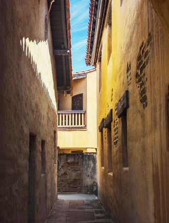 Composite photo of a narrow alley in a European cityの写真素材