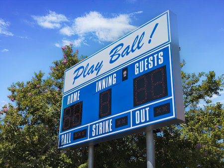 Low angled view of an electronic scoreboard at a youth baseball fieldの写真素材