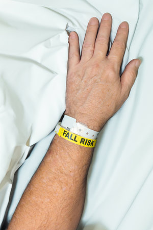 A hospital patient wearing a fall risk braceletの写真素材