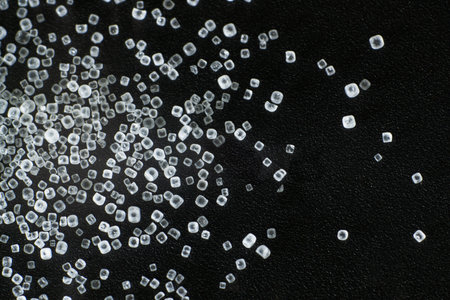 White salt crystals isolated on black background and texture, macroの写真素材