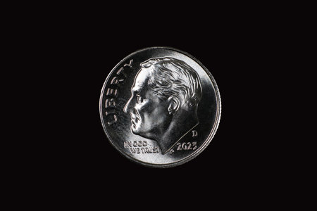 United States Dime (10 cents) coin isolated on black.の写真素材