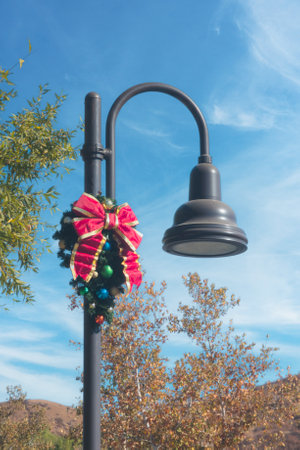A Christmas decoration on a street light poleの写真素材