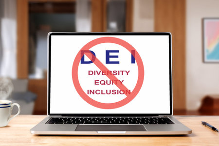 A laptop with DEI in red banned circle