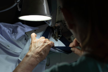 woman working at sewing machineの写真素材