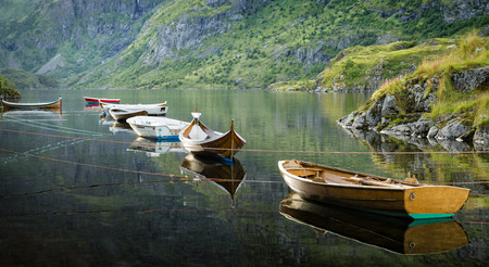 Boats moored on calm water.の写真素材