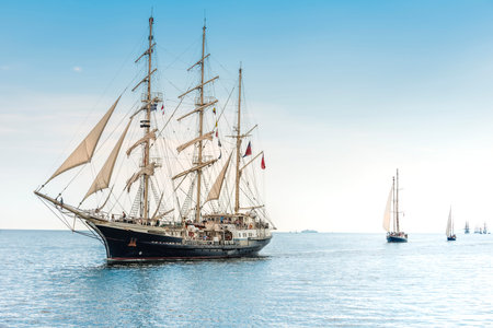 Tall ship sailing on blue water