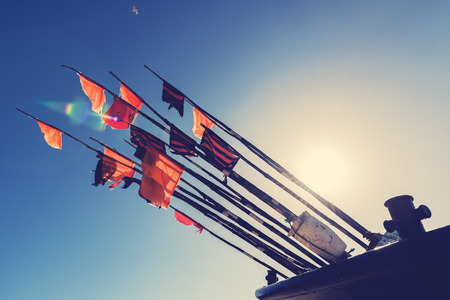 Colorful fishing flags to mark the fisheries in cutter.の写真素材