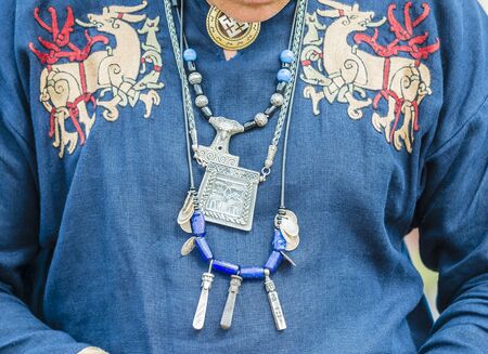 Medieval ornaments hung on the chest Viking warrior.の写真素材