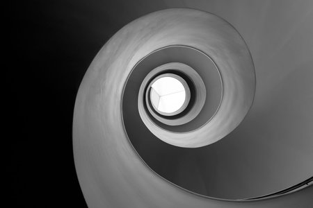 Spiral staircase view from below.