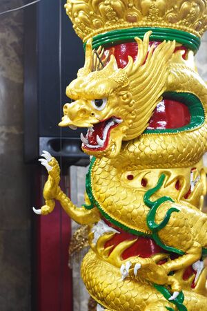 Beautiful Golden Dragon Statue in the chinese temple , Bangkok , Thailandの写真素材