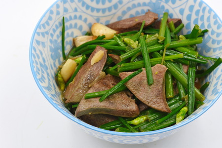 Stir Fried Garlic Chive Flowers with Pork Liverの写真素材