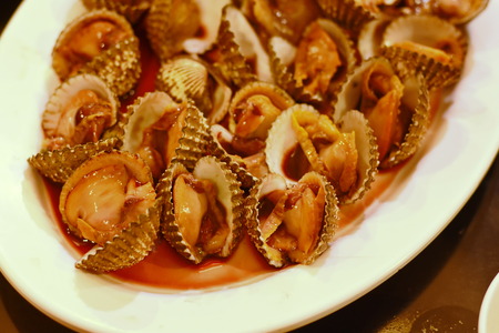 Steamed blanched clams with dipping sauceの写真素材