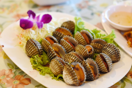 Steamed blanched clams with dipping sauceの写真素材