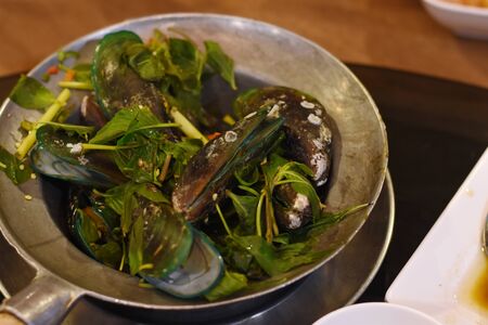 Steamed mussels and thai spicy sauceの写真素材