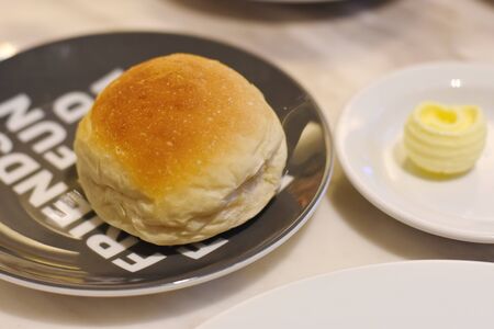circle bread and yellow butterの写真素材