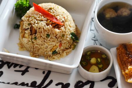 fried rice with crispy fishの写真素材