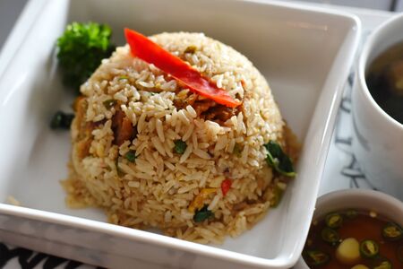 fried rice with crispy fishの写真素材