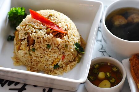 fried rice with crispy fishの写真素材