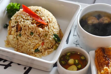 fried rice with crispy fishの写真素材