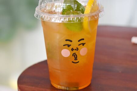 ice lemon tea in a beautiful cupの写真素材