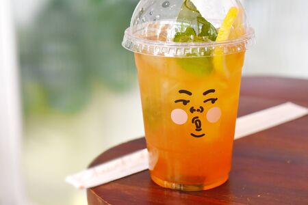 ice lemon tea in a beautiful cupの写真素材