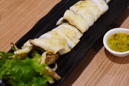 grilled calamari with thai spicy sauceの写真素材
