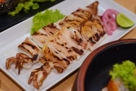 Grilled squid on a plate in a Japanese restaurant, close-up
