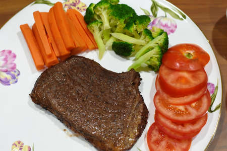 delicious meat steak Homemade with vegetableの写真素材