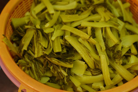 Close-up of a bowl of chopped celery in the kitchen