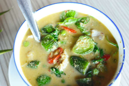 Thai food : Spicy green curry with pork in a bowlの写真素材
