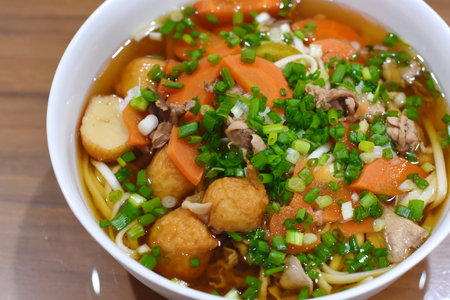 Ramen noodle soup with tofu, carrot and green onion