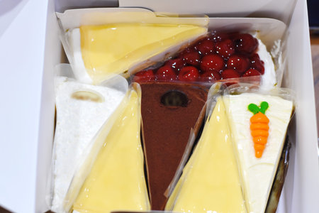 Close up of a box with a variety of delicious desserts and sweets
