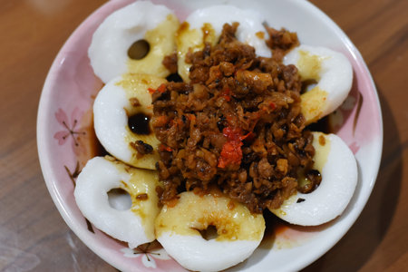 Stir-fried egg with minced pork and chili sauce on plate