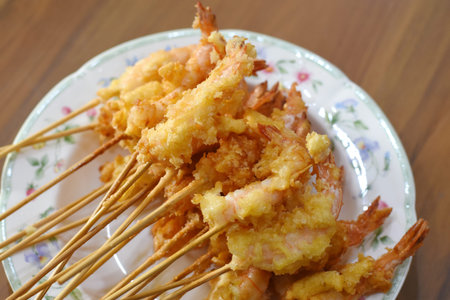 Fried shrimp on wooden stick, Thai style fried shrimp on wooden stick