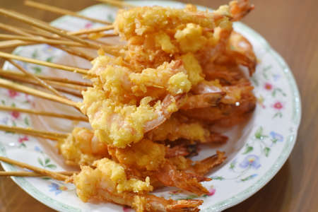 Fried shrimp on wooden stick,Thai style food,Thailandの写真素材