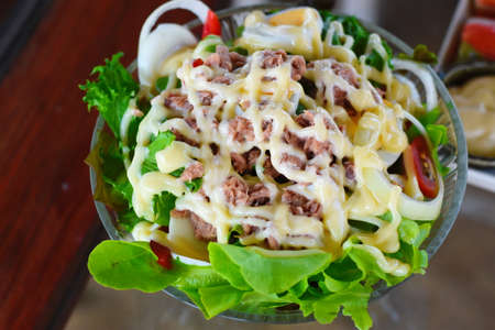 Salad of fresh vegetables and meat with mayonnaise dressing.の写真素材