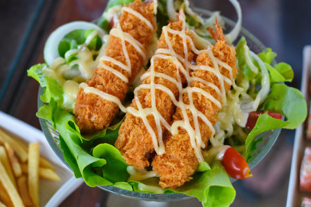 Crispy fried chicken with cheese, lettuce and mayonnaise