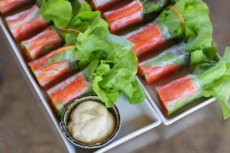 Sticks of crab stick with salad and mayonnaise in box