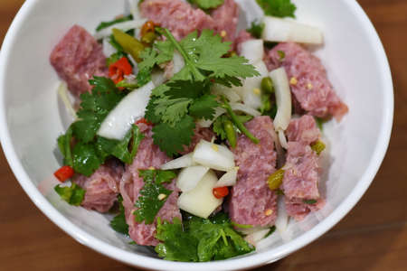 Thai Spicy minced pork salad with fresh coriander leavesの写真素材