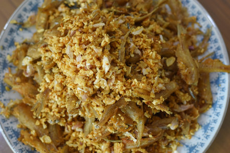 Fried rice with fried onions in a bowl on the tableの写真素材