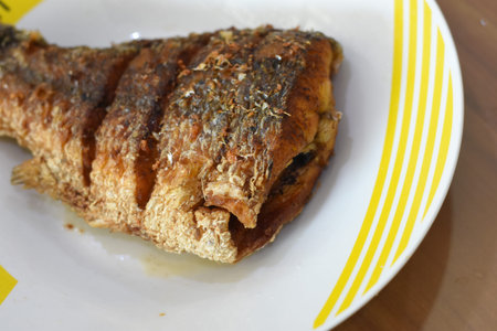 Fried mackerel fish on a plate. Close-up.の写真素材